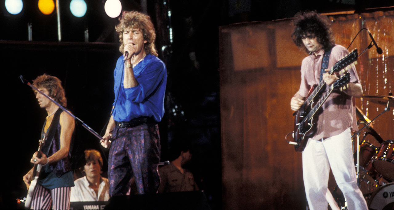 Charlie Jones, John Paul Jones (seated), Robert Plant and Jimmy Page of Led Zeppelin on July 13, 1985 at Live Aid in Philadelphia, PA. (Photo by Ron Galella/Ron Galella Collection via Getty Images)