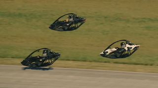 Screenshot taken from the recent Jetson One demonstration showing three personal aircraft racing while hovering over a tarmac.