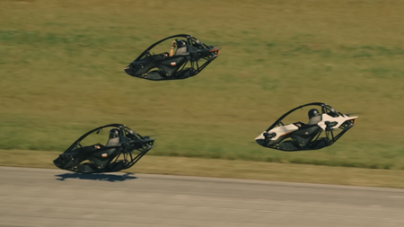 Screenshot taken from the recent Jetson One demonstration showing three personal aircraft racing while hovering over a tarmac. 