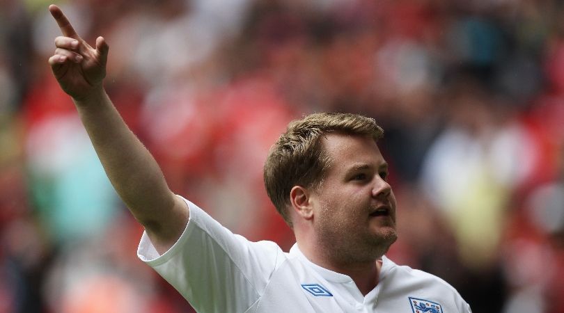 James Corden, wearing an England shirt, celebrates after scoring a penalty during the half-time interval of the Community Shield in August 2011.