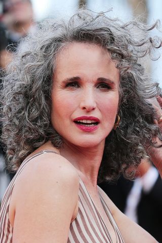 Andie MacDowell is pictured with grey hair whilst attending the screening of "Mother And Son (Un Petit Frere)" during the 75th annual Cannes film festival at Palais des Festivals on May 27, 2022 in Cannes, France.