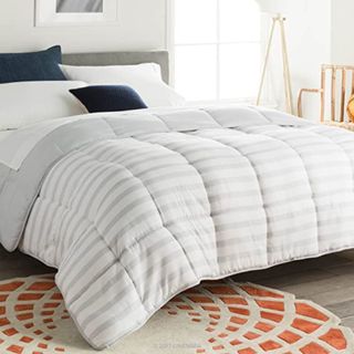 Down alternative comforter on bed