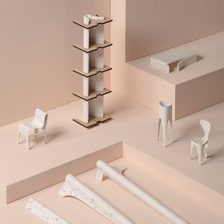 A peculiar collection of furniture in a pink display room