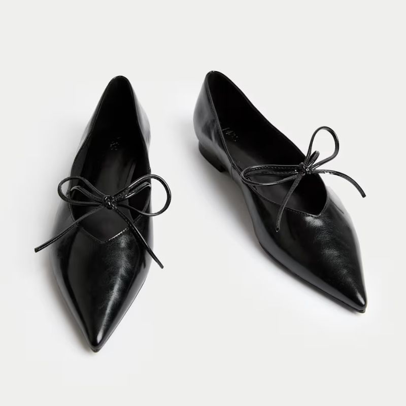 black ballet flats with pointed toe and bow detail
