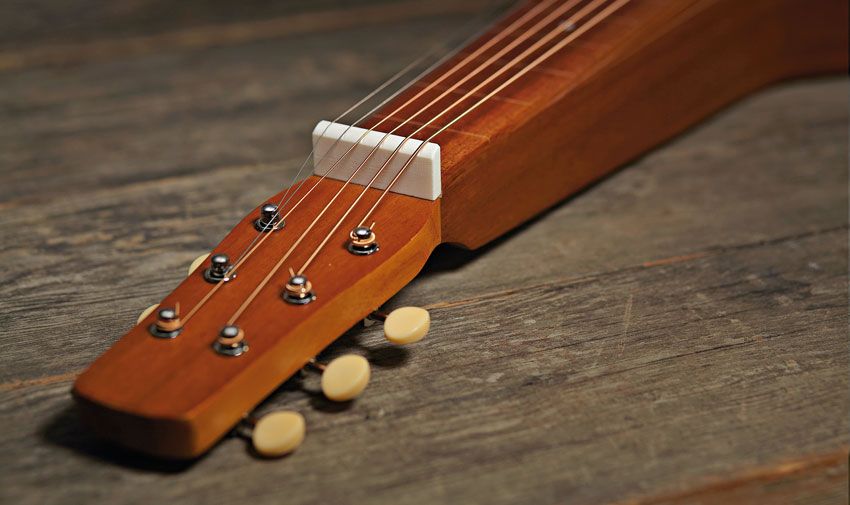 The bone nut lifts the strings just under 20mm off the 'board, meaning you can be very spirited with your slide