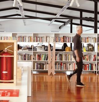 In the foreground of Alt's gallery-like space, artwork sits side-by side with works in progress. Behind the bookshelves you'll find the designers and their Macs