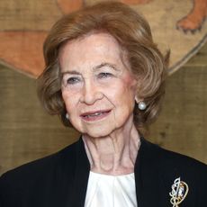 Princess Leonor saluting in a military uniform; Queen Sofia of Spain in a black blazer smiling