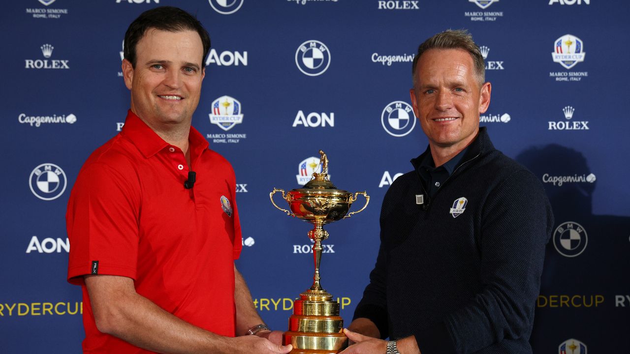 Zach Johnson and Luke Donald pose with the Ryder Cup at a 2022 media event