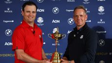 Zach Johnson and Luke Donald pose with the Ryder Cup at a 2022 media event
