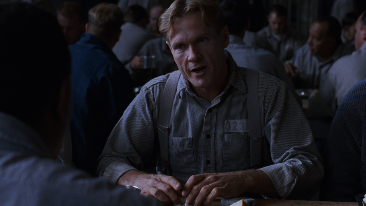 William Sadler as Heywood sorting cigarettes in The Shawshank Redemption