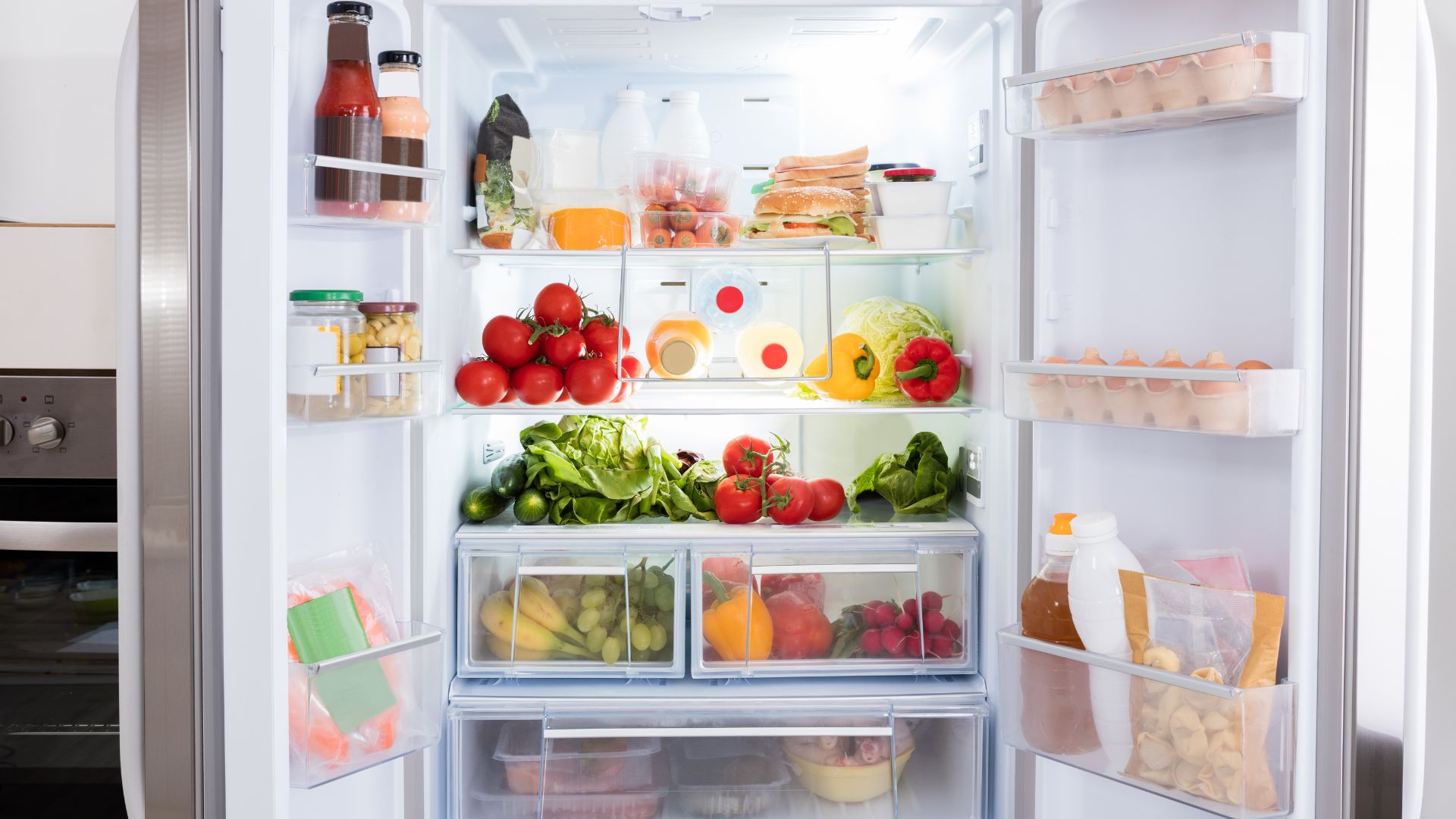 An open fridge with organised shelves and space