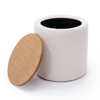 A round boucle storage stool with wooden lid