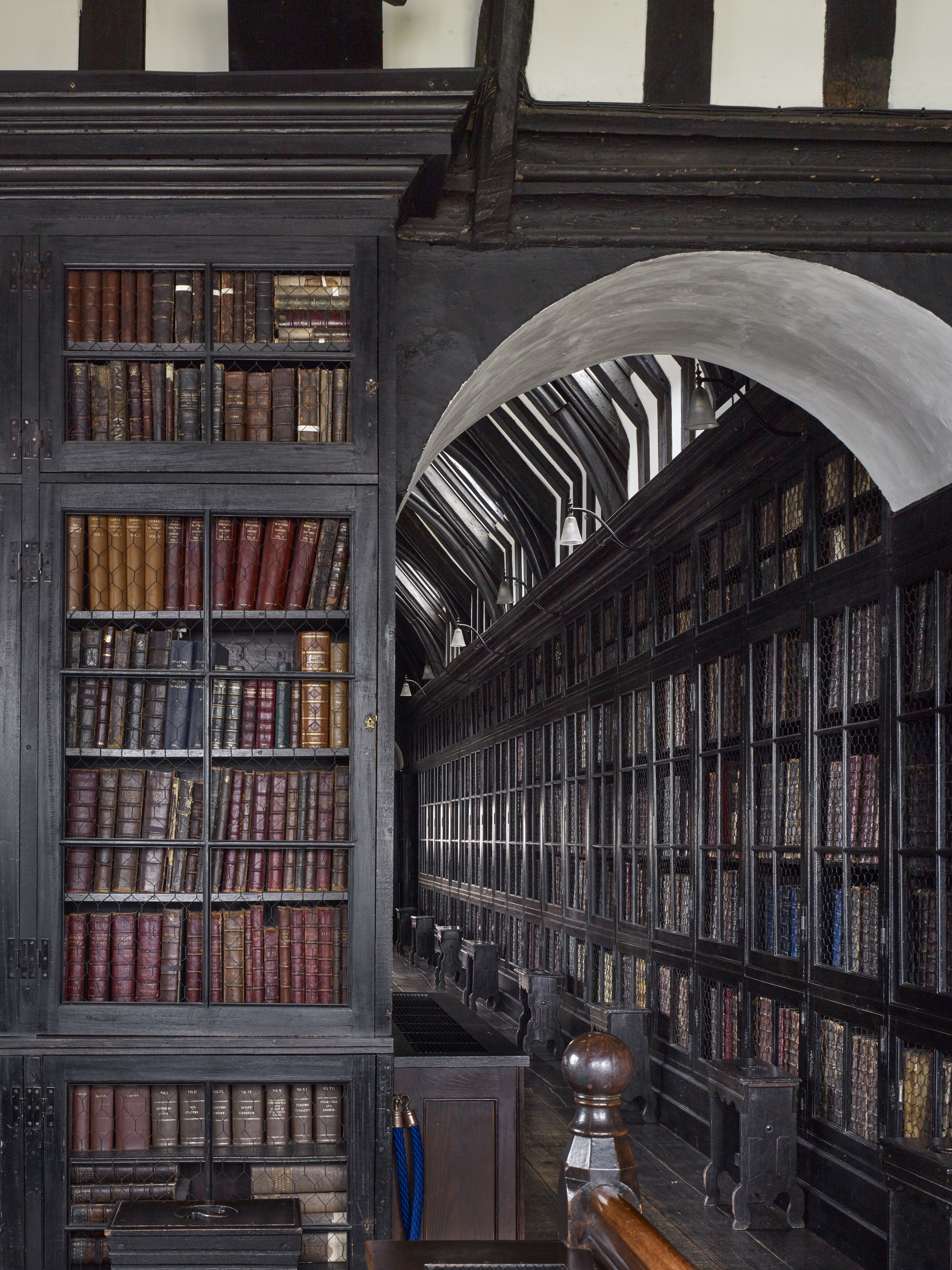 Dark wood library shelves filled with books