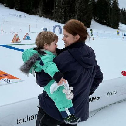 Princess Eugenie holding her son Ernest at a ski resort