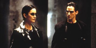 Trinity and Neo stand together in 'The Matrix'