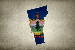 Grunge map of the state of Vermont (USA) with its flag printed within its border