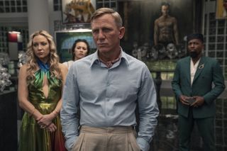 Kate Hudson as Birdie, Jessica Henwick as Peg, Daniel Craig as Detective Benoit Blanc, and Leslie Odom Jr. as Lionel in 'Glass Onion: A Knives Out Mystery'