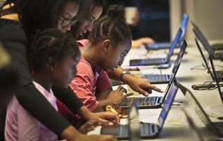 Girls learning to code.
