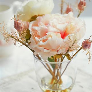 flowers with vase and plastic carnations