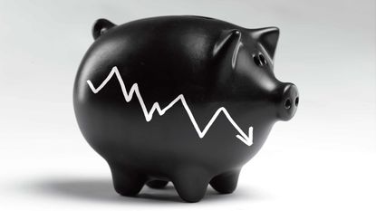 black piggy bank with downward chart on side