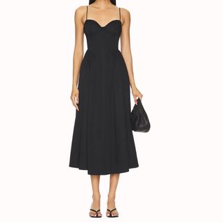 Flat lay image of woman wearing black dress