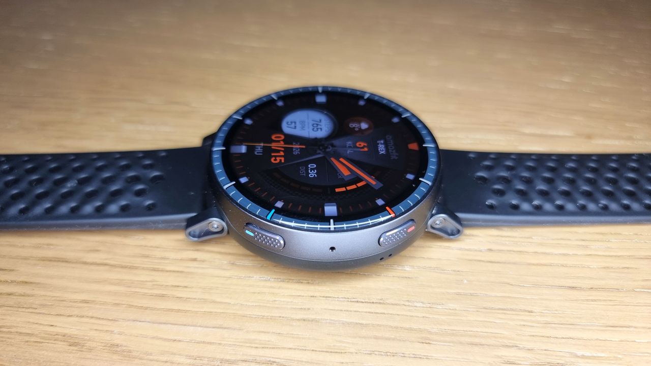 A close-up picture of the Amazfit Active Max smartwatch laid out flat on the desk