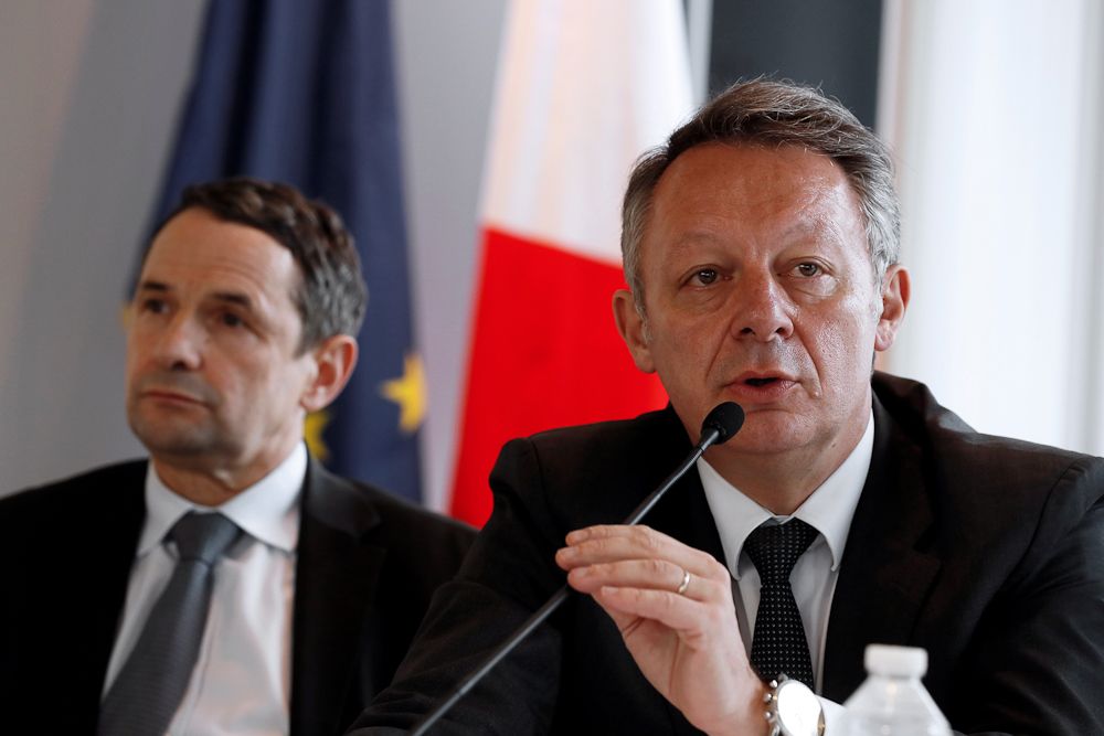 French Minister for Sports Thierry Braillard (R), flanked by French Minister for Higher Education and Research Thierry Mandon (L), speaks during a press conference on mechanical fraud, in Paris, on June 27