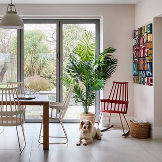 open plan dining area with colour contrast spindle chairs