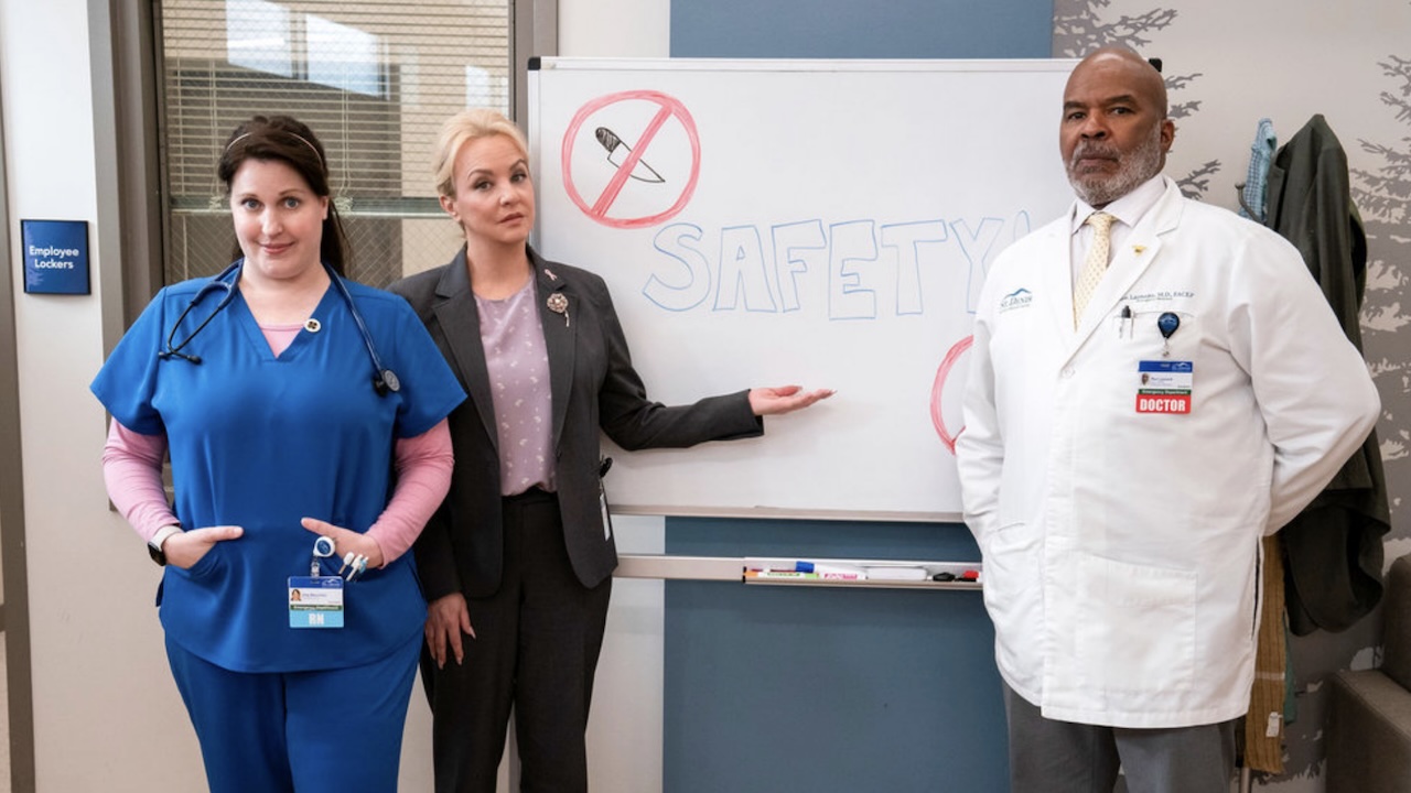 Joyce, Ron and Alex standing in front of Safety Meeting board in St. Denis Medical Season 2