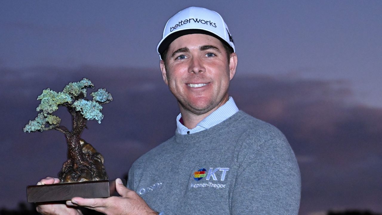 Luke List with the trophy after winning the 2022 Farmers Insurance Open at Torrey Pines