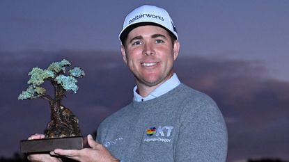 Luke List with the trophy after winning the 2022 Farmers Insurance Open at Torrey Pines