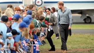 Prince Harry, Duke of Sussex and Meghan, Duchess of Sussex meet waiting public as they arrive at Dubbo Airport on October 17, 2018 in Dubbo, Australia. The Duke and Duchess of Sussex are on their official 16-day Autumn tour visiting cities in Australia, Fiji, Tonga and New Zealand.