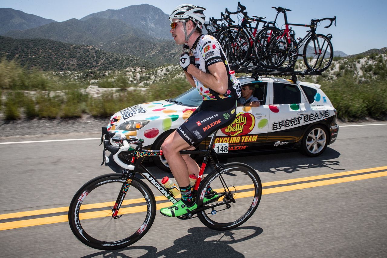 Ben Wolfe (Jelly Belly) goes to the team car for water bottles