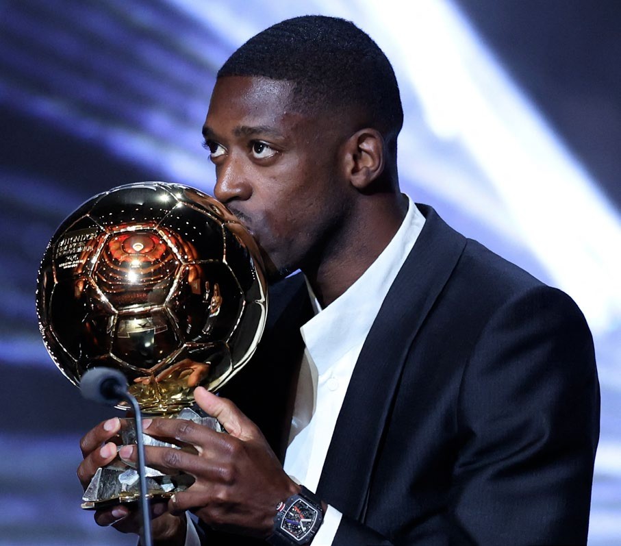 Paris Saint-Germain's French forward Ousmane Dembele kisses the Ballon d'Or award during the 2025 Ballon d'Or France Football award ceremony at the Theatre du Chatelet in Paris on September 22, 2025. (Photo by Franck FIFE / AFP) (Photo by FRANCK FIFE/AFP via Getty Images)