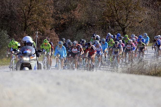 The peloton chases down the Strade Bianche
