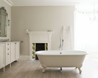 white traditional bathroom with freestanding bath