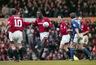 Andy Cole is congratulated by his Manchester United team-mates after scoring the third of his five goals in a 9-0 win over Ipswich Town in March 1995.