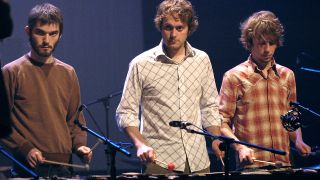 Kjartan Sveinsson (L), Georg Holm (C) and Orri Pall Dyrason (R) of Sigur R&oacute;s during a rehearsal of Odin's Raven Magic in Paris, 28 September 2004. (Photo by MAXIMILIEN LAMY / AFP)