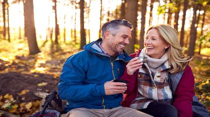 Older couple sitting in a forest 