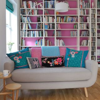bookshelves with sofa and cushions