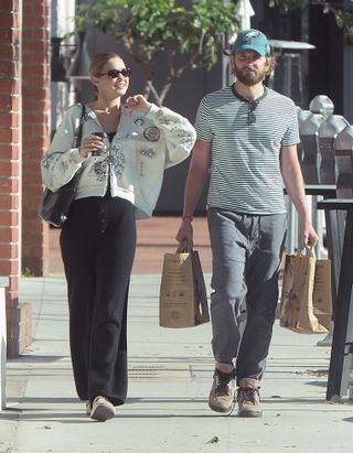 A photo of Gigi Hadid and Bradley Cooper wearing sweatpants