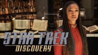 promotional photo for "star trek: discovery" showing a woman with long black braids wearing a red space uniform 