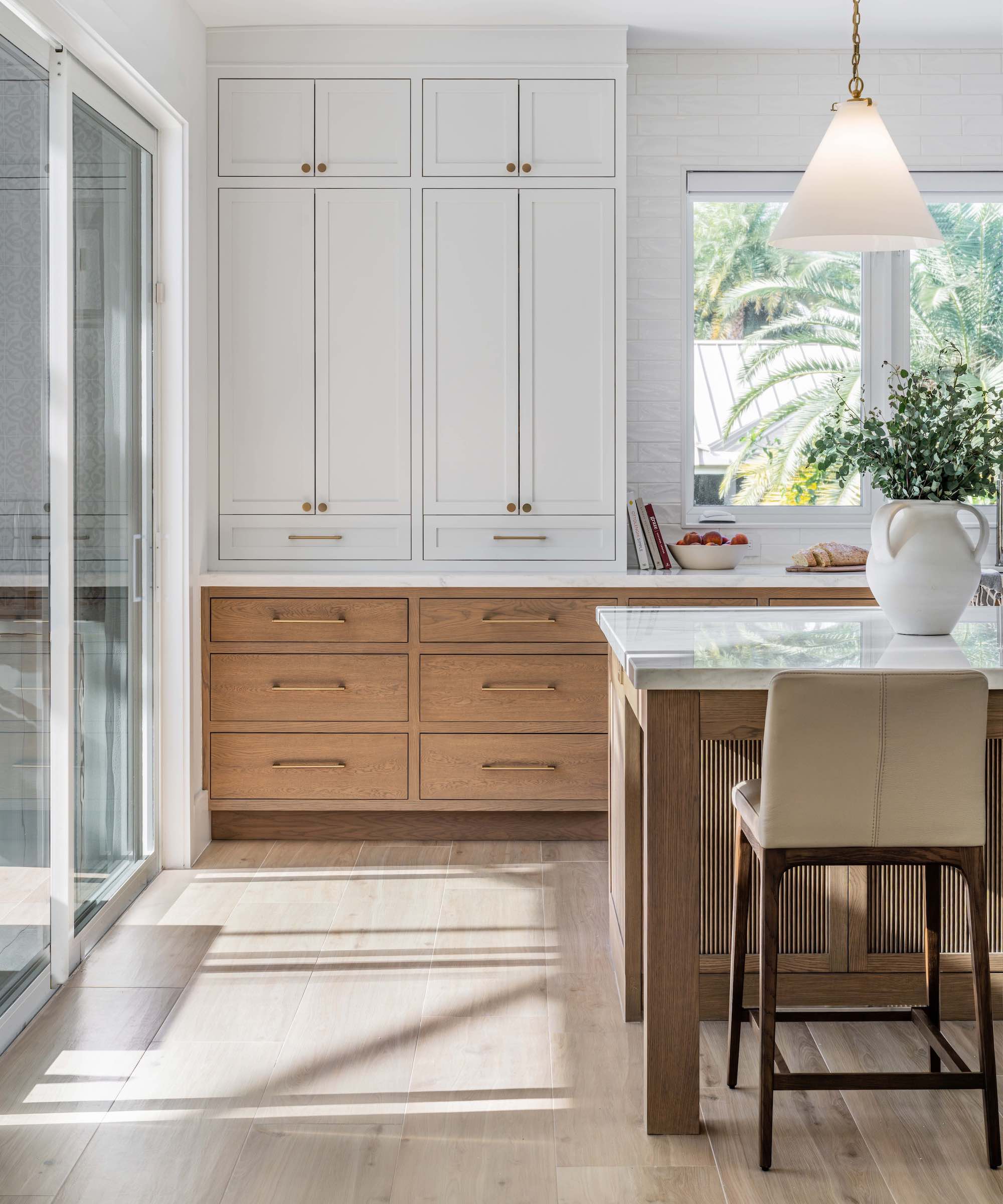 wood and white kitchen with marble island