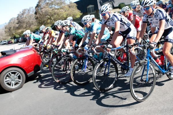 The women tuck in close behind the official's car for the neutral start.