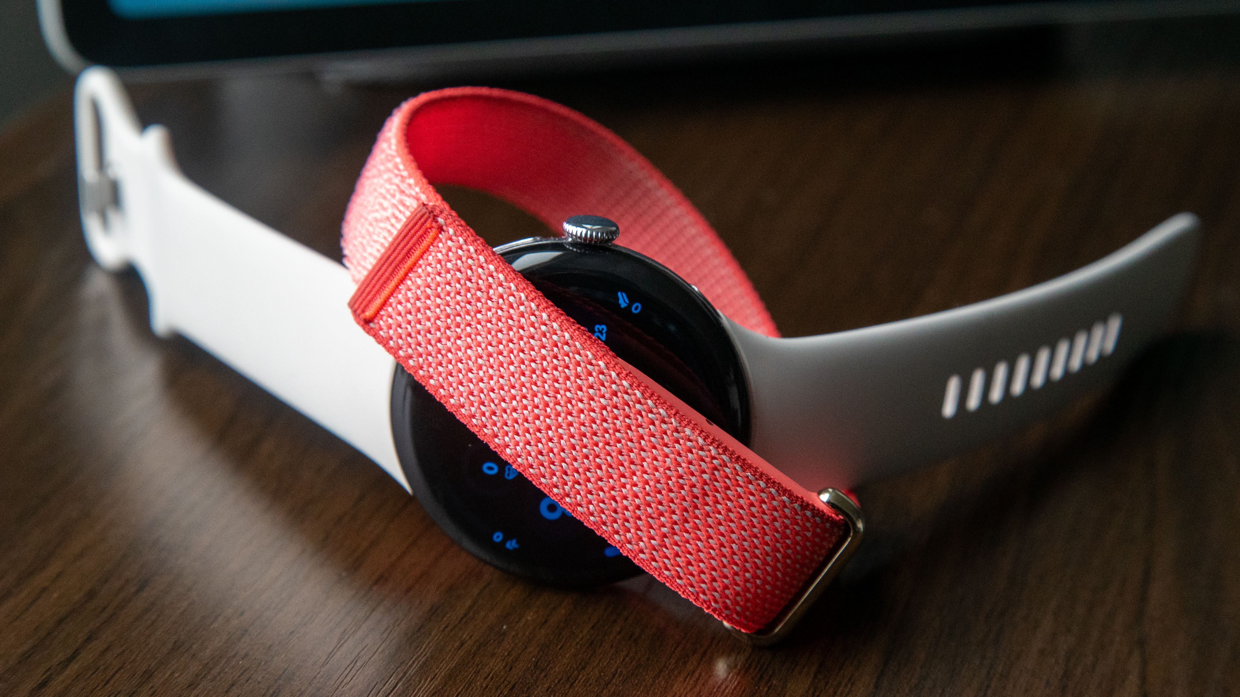 The Fitbit Air wrapped around a Pixel Watch 4