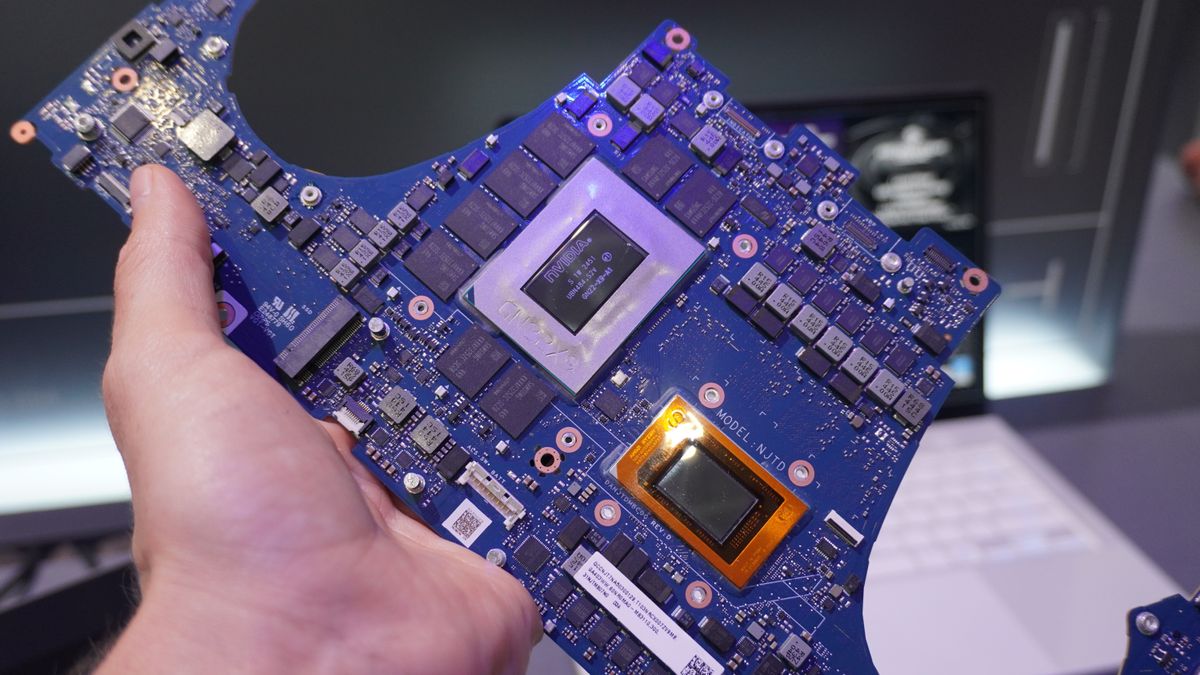 Asus ROG Zephyrus G14 motherboards in hand