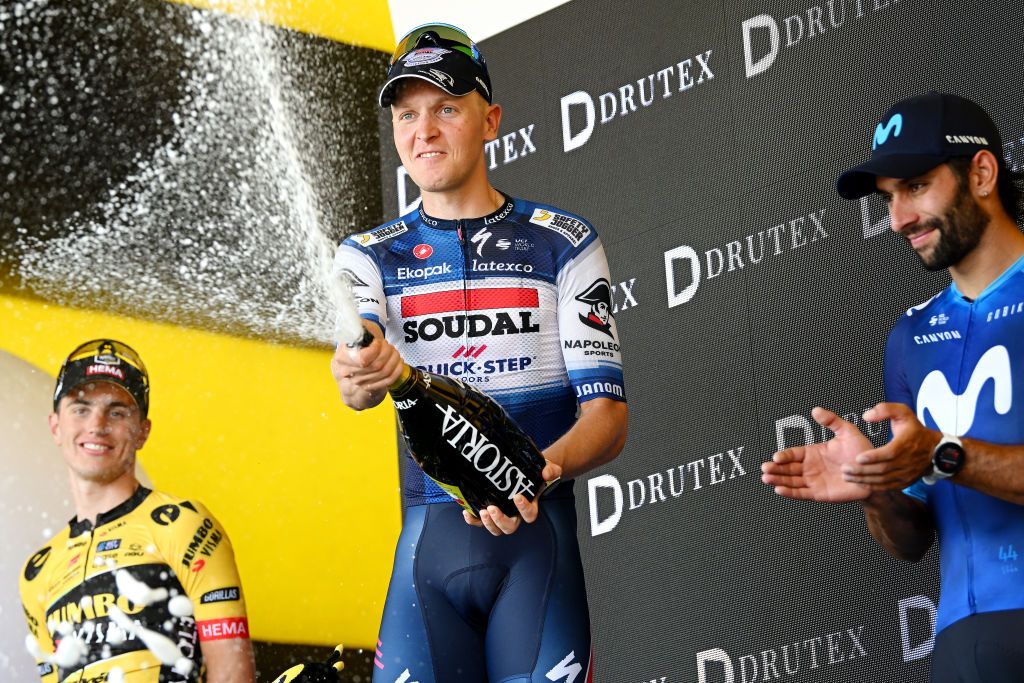 Stage 1 winner Tim Merlier (Soudal Quick Step) celebrates stage 1 victory with second place Olav Kooij (Jumbo-Visma) and third place Fernando Gaviria (Movistar)