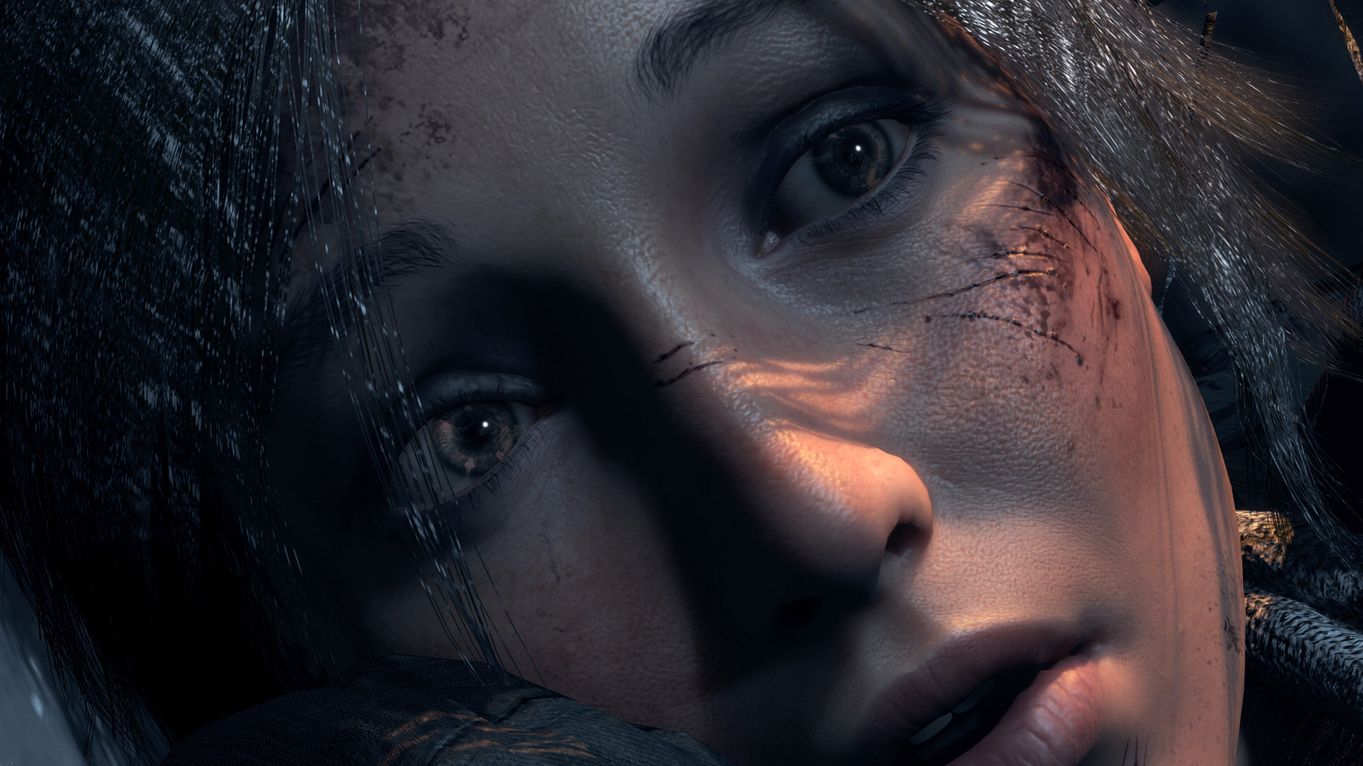 A close-up of Lara Croft's face from Rise of the Tomb Raider