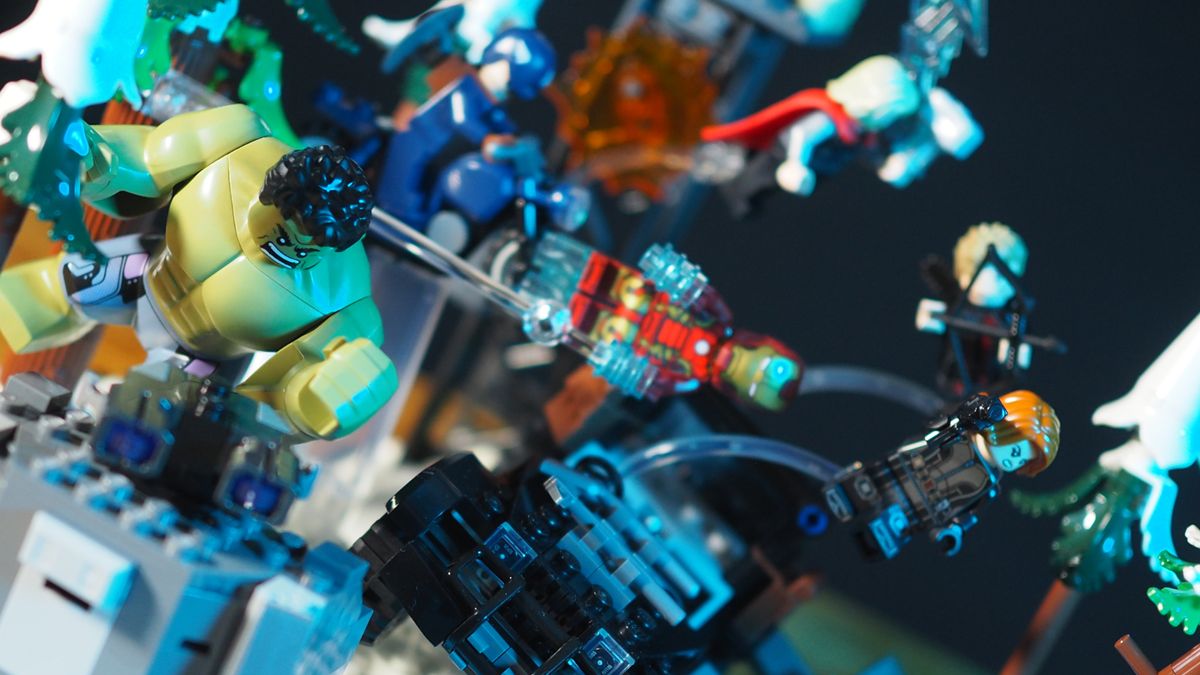 Lego Avengers in mid-air poses amongst snowy trees