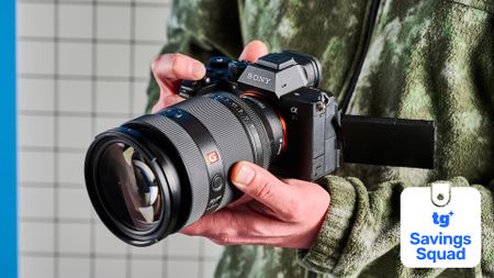 A person holding a Sony A7R V mirrorless camera